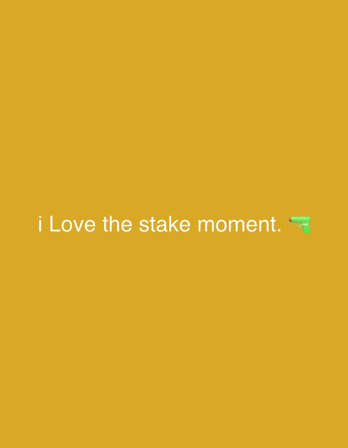 The image has a golden-yellow background. Centered on the image is the phrase "i Love the stake moment." with a green water gun emoji to the right. The font color is white.