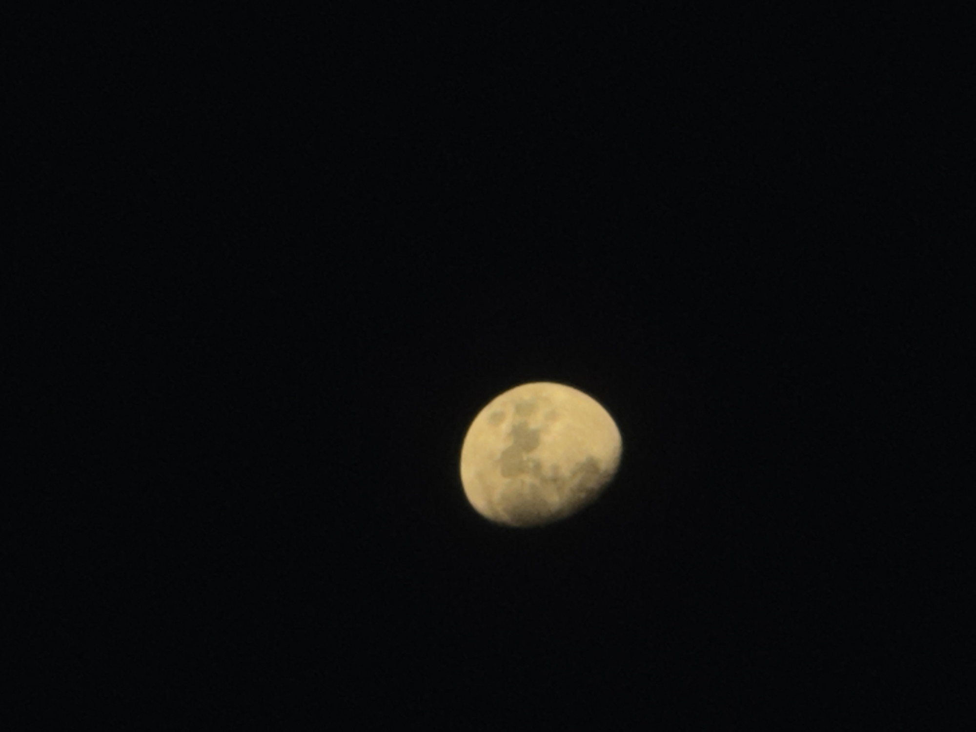This media file is a photograph of the moon in the night sky. The moon is partially illuminated, showing a crescent shape with visible craters and surface details. The background is a deep black, indicating nighttime. There are no people, text, or specific location cues visible in the image, other than the provided context of Torrevieja, Spain, which suggests the photograph was taken there. The overall mood is serene and captures a moment of observing the celestial body.