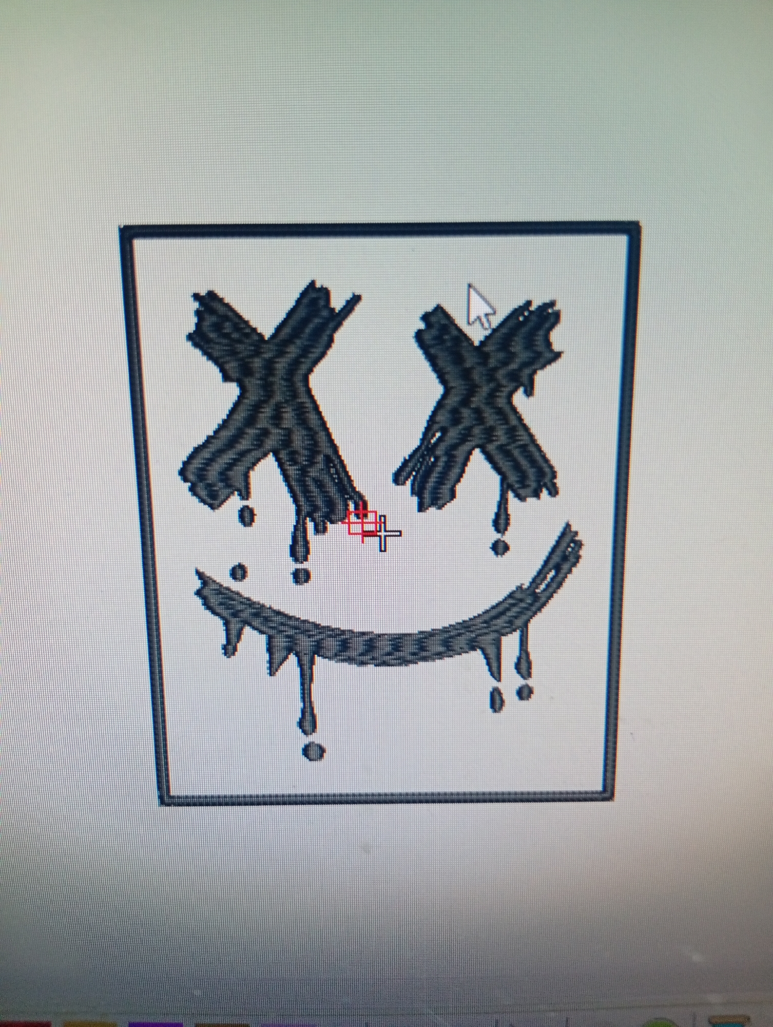 The image shows a close-up, angled shot of a computer screen displaying a graphic design. The graphic features a black outlined square containing a stylized face. The face has two large, black "X" shaped eyes with dripping effects. Below the eyes, there is a wide, curved mouth also with a dripping effect, resembling a melting smile. Two small dark circles are present as a nose. A red and white crosshair cursor is positioned over the mouth area. The screen itself exhibits pixelation, indicating it's a digital display. The background of the screen is a light gray. The bottom of the image shows the edge of the computer screen with a faint glimpse of what appears to be a taskbar with icons. The image does not contain any identifiable landmarks or features that would place it in a specific city like Rumuepirikom, Nigeria.