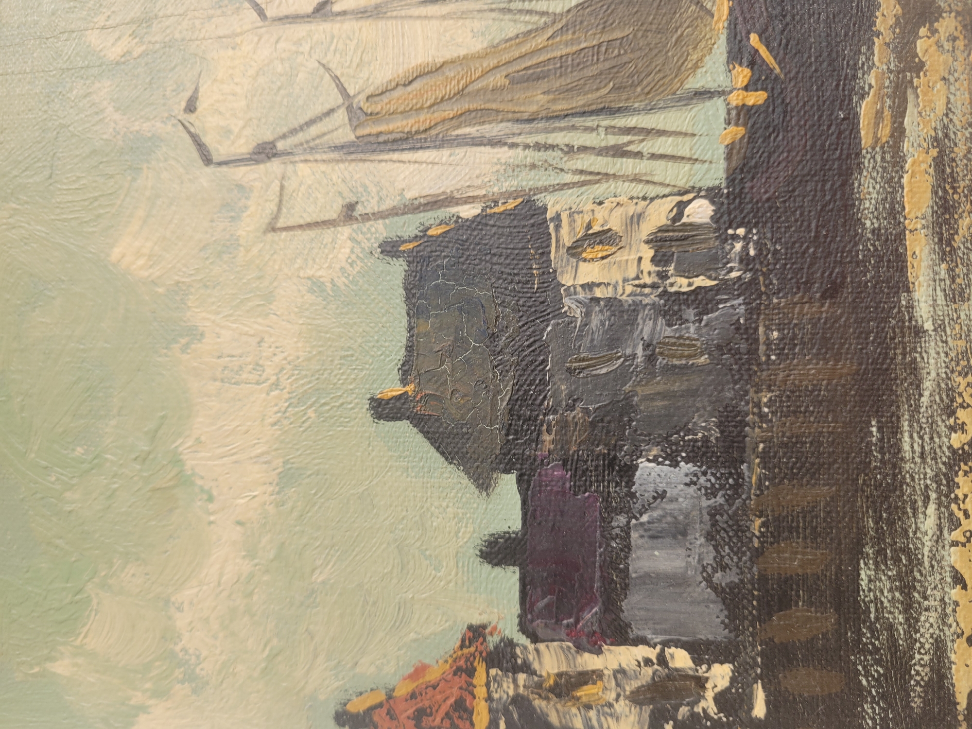 This is an oil painting of a harbor scene. In the foreground, dark brown and black brushstrokes depict the water or dock. To the left, several buildings are rendered with thick impasto. The building closest to the left edge has an orange-red roof with yellow highlights and a white lower section. Adjacent to it is a building with a dark purple roof and gray walls. The central building features a dark gray, textured roof with yellow accents on what appear to be chimneys. It has a lighter-colored facade with visible window details. To the right, the masts and sails of several sailboats are depicted. The sails are primarily cream and tan, with gray rigging. The sky is a pale, light green with visible brushstrokes suggesting clouds. The painting's style is impressionistic, with bold, textured application of paint. There are no people visible in the painting. The scene is consistent with a harbor in Gävle, Sweden, possibly depicting the old harbor area with its historic buildings and sailing vessels.