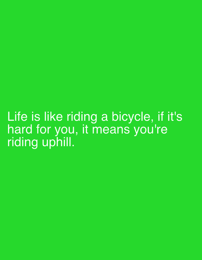 The image displays a green background with white text. The text reads: "Life is like riding a bicycle, if it's hard for you, it means you're riding uphill." There is no discernible location in the city of Cork, Ireland, or any people, subjects, objects, or actions depicted in the image.