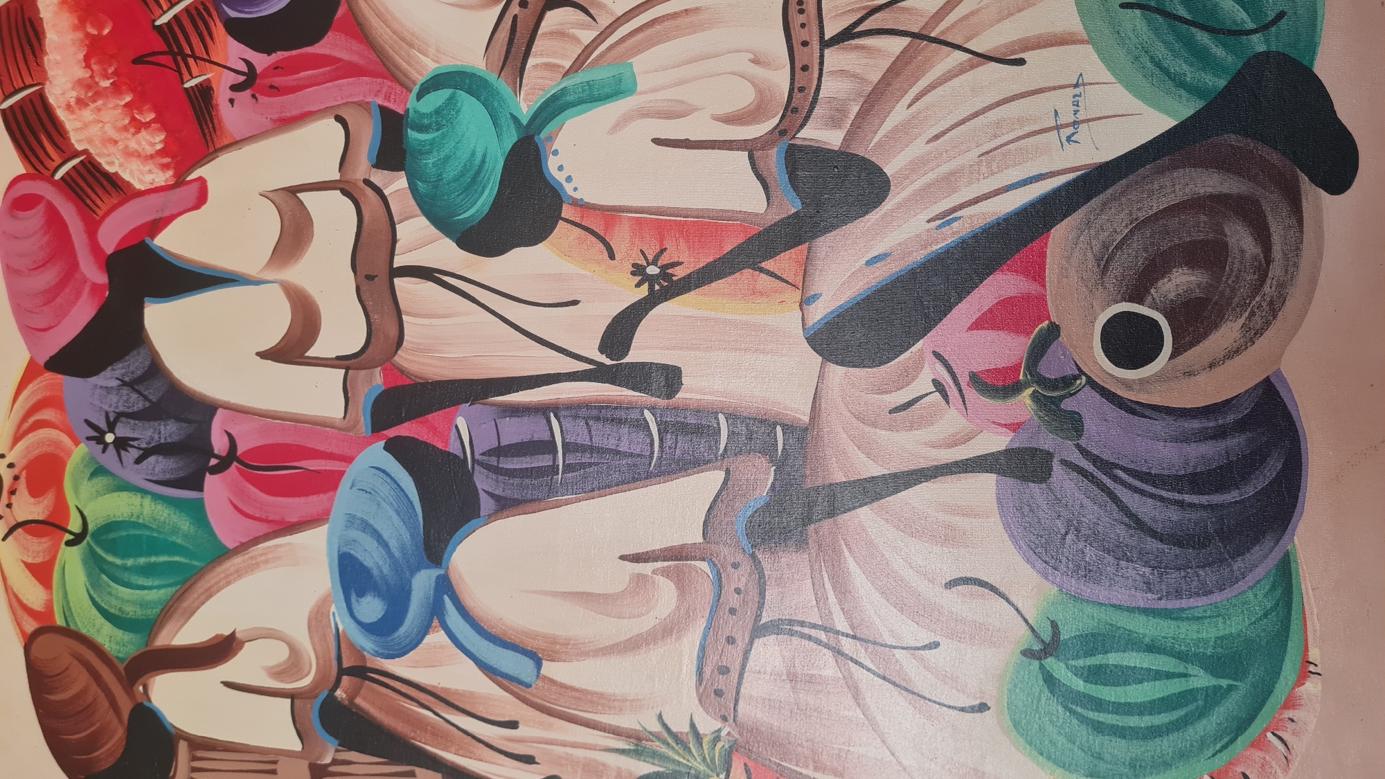 This is a painting depicting a group of people, likely women, in a marketplace or gathering, surrounded by large, stylized fruits. The figures are rendered with bold outlines and flat areas of color, characteristic of a naive or folk art style. They are adorned with headwraps in various colors including blue, green, and pink. Some figures appear to be carrying baskets or bundles on their heads. The fruits in the foreground are exaggerated in size and color, with prominent examples including green watermelons and purple, rounded fruits that could be eggplants or similar produce. The background is filled with more colorful, abstract shapes suggesting additional produce or background elements. There is a visible signature in the lower right corner that appears to read "Ronald". The artwork is a painting, not a photograph of a specific location. Therefore, it cannot be precisely located in the city of Elda, Spain, or any other specific geographical location.