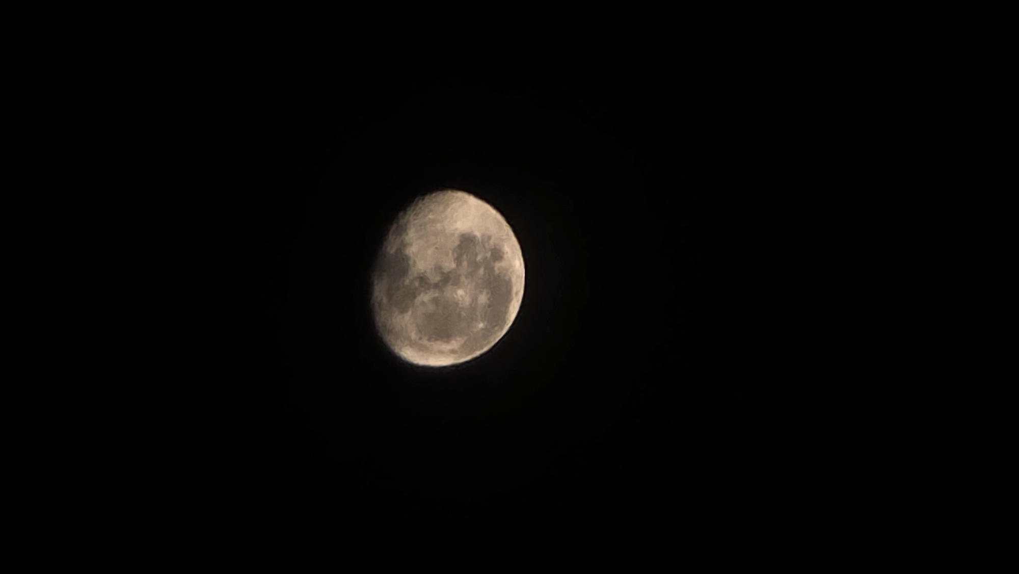 A photograph depicts a phase of the moon set against a black background. The moon is centered in the image and displays visible craters and surface details. The exact location within Bac Nha Trang Ward, Vietnam, is not determinable from the image alone.