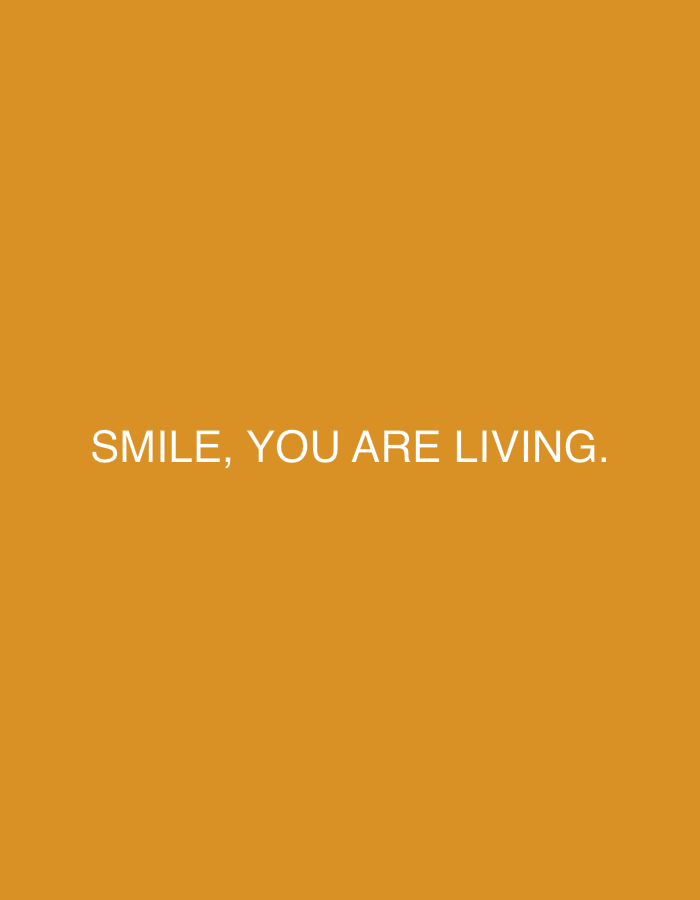 The image features an orange background with the white text "SMILE, YOU ARE LIVING." centered. The scene is located in an unknown city.