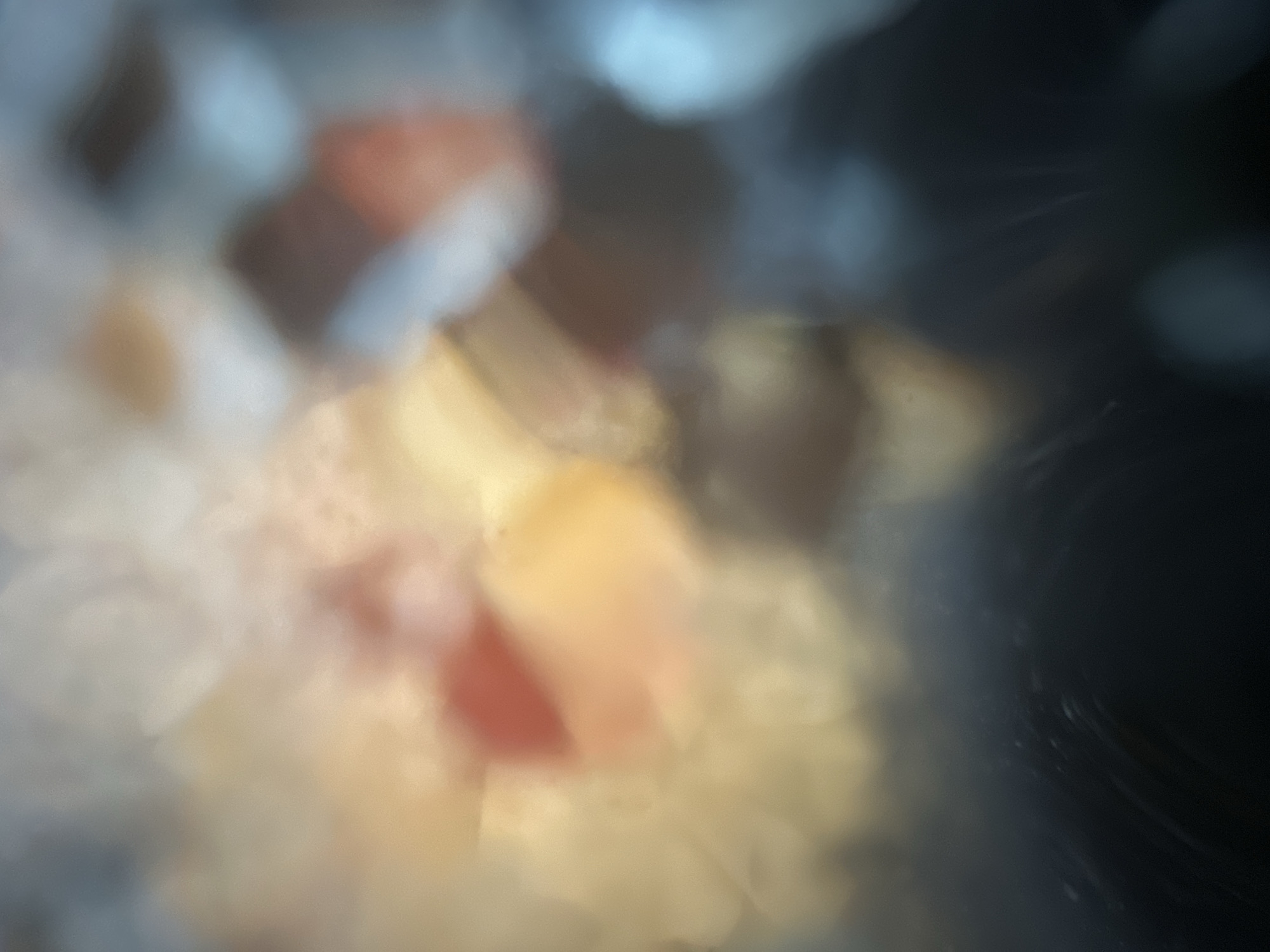 The image is an abstract, out-of-focus shot with a soft, dreamlike quality. It features a blend of warm yellows, oranges, and reds, interspersed with cooler blues and grays. There are no discernible people, subjects, or objects that can be identified with certainty. The overall impression is one of diffused light and color, possibly representing bokeh effects or a very impressionistic view of something. The location in Belgrade, Serbia, cannot be determined from the visual information provided.