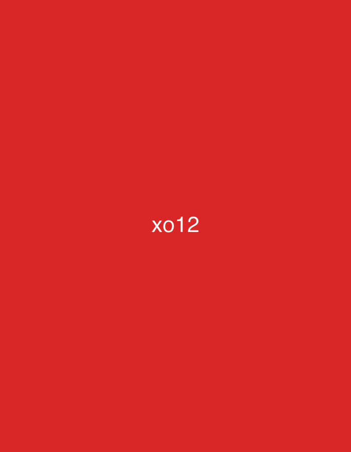 The image displays a solid, uniform red field. Centered within this red background is the white text "xo12". No other subjects, objects, people, actions, or environmental details are present. The image does not contain any visual information to indicate a location in the city of Casablanca, Morocco, or any other specific geographical location.
