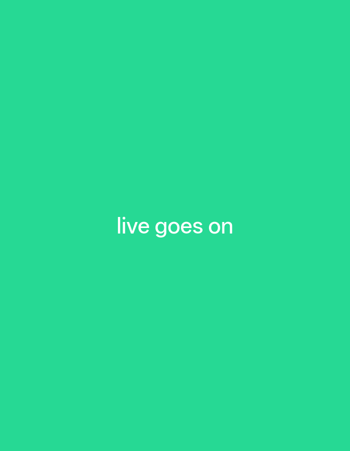A screen displays the text "live goes on" in white, centered vertically and horizontally against a bright green background. There are no other objects, people, or environmental details visible in the image. The image provides no information about the city of Payagaboh, Indonesia.