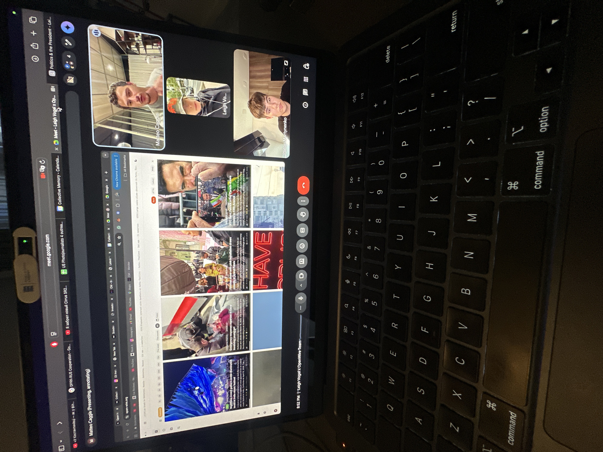 A screen capture shows a person on a Google Meet call with three other people. A Chrome browser window is open with several tabs, including links related to the war in Ukraine and photojournalism. The laptop keyboard is visible. The screen capture does not contain information about the location in the city of Kyiv, Ukraine.