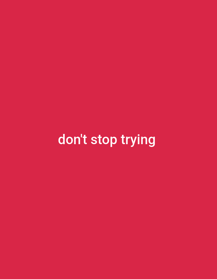 The image is a plain pink background with the text "don't stop trying" written in white, centered vertically and horizontally. There is no discernible city or location information visible in the image itself.