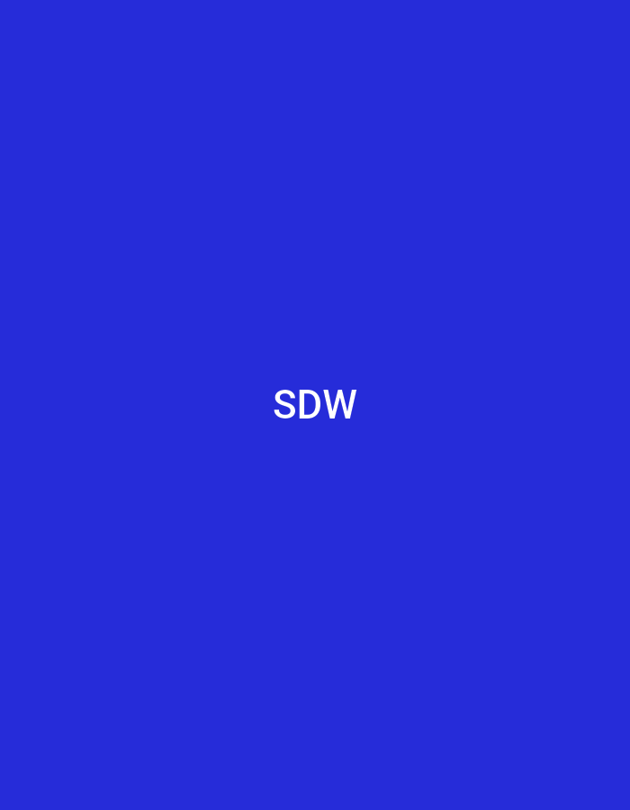 The image displays a uniform, solid blue background. Centered horizontally and vertically within this blue field are the uppercase white letters "SDW." There are no other discernible subjects, objects, people, actions, or environmental details present. The image provides no visual information to suggest a specific geographical location, including the city of Casablanca, Morocco.