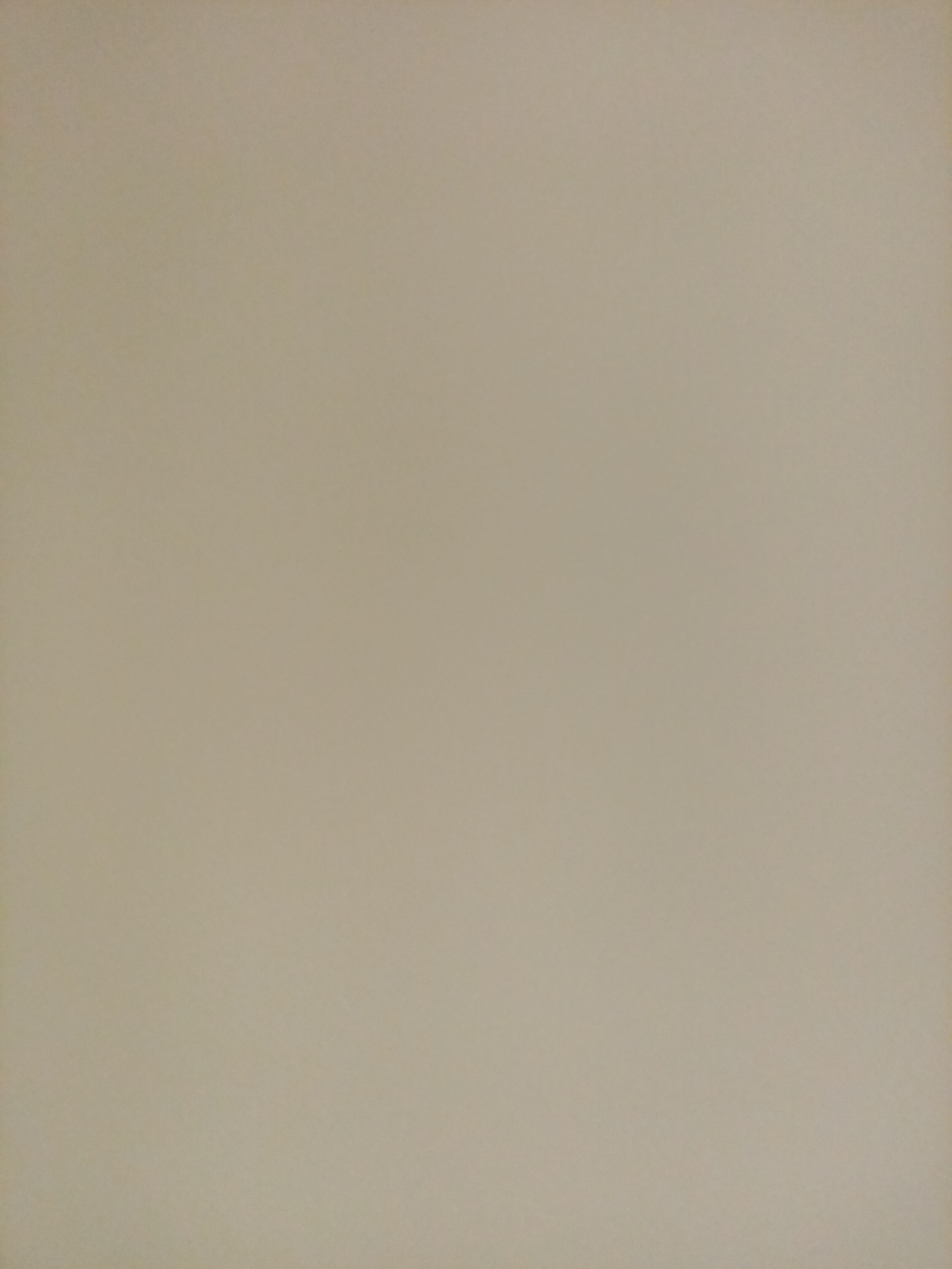 The image is a plain, light beige background, likely a wall or a piece of paper. There are no discernible objects, people, or actions depicted. The lighting is uniform across the frame, with no shadows or highlights indicating a specific location or time of day. The surface appears to have a fine, almost imperceptible texture. Without any contextual clues, it is impossible to determine the location, including whether it is in Rostov-on-Don, Russia.