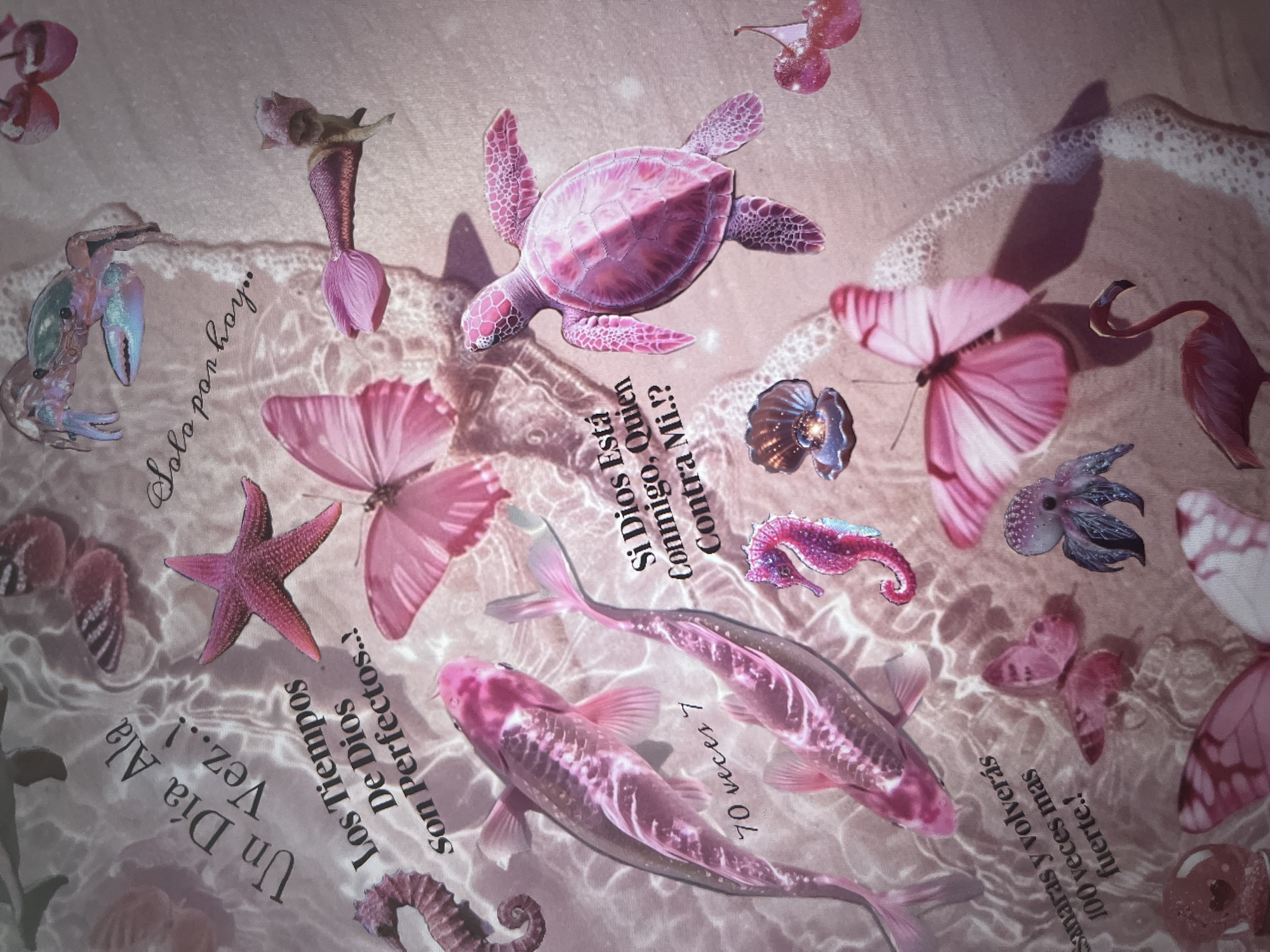 This is a close-up, overhead shot of a collage on a textured, pale pink background, possibly fabric, resembling a sandy beach with shimmering water effects. The collage features various marine-themed cutouts and butterflies, predominantly in shades of pink and purple.
The subjects include a pink sea turtle swimming in the center, a mermaid with a pink tail and a floral headpiece, a pink starfish, two pink koi fish, a pink seahorse, a pink lobster, and several pink butterflies. There are also some dark, iridescent sea creatures that appear to be shells or anemones. The water effect is created with white, frothy waves and light refractions.
Scattered across the image are pieces of text in a dark font. The text appears to be in Spanish and includes phrases such as "Solo por hoy.." (Only for today..), "Un Día Ala Vez..!" (One Day At A Time..!), "Los Tiempos De Dios Son Perfectos..!" (The Times Of God Are Perfect..!), "Si Dios Está Conmigo, Quien Contra Mi.!?" (If God Is With Me, Who Against Me.!?), "70 veces 7" (70 times 7), and "Sanaras y volverás 100 veces mas fuerte.!" (You will heal and return 100 times stronger.!).
The overall impression is whimsical and serene, with a fantasy-like or dreamlike quality due to the color palette and the fantastical elements. There are no visible people, and the time of day and weather are not discernible beyond the water-like visual effects. The location is suggested to be a beach or underwater environment through the collage's theme.