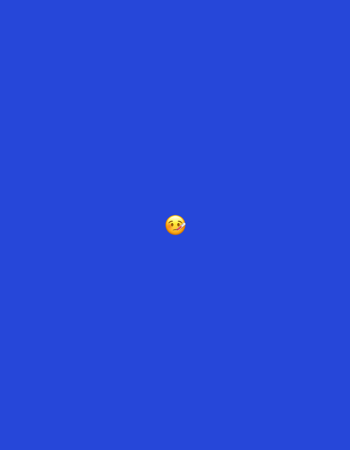 The image displays a solid, vibrant royal blue background. Centered horizontally and vertically on this monochromatic field is a single yellow circular emoji. The emoji depicts a smiling face with wide-open eyes, a broad open mouth revealing white teeth, and a red tongue extended from the side of the mouth, signifying deliciousness or savoring food (😋). The image is a two-dimensional digital graphic with no discernible real-world environment, people, objects, actions, or interactions beyond the static emoji on the abstract background. No information regarding a specific location in the city of Santa Ana, Venezuela, or any other geographical context is present or discernible within the image.