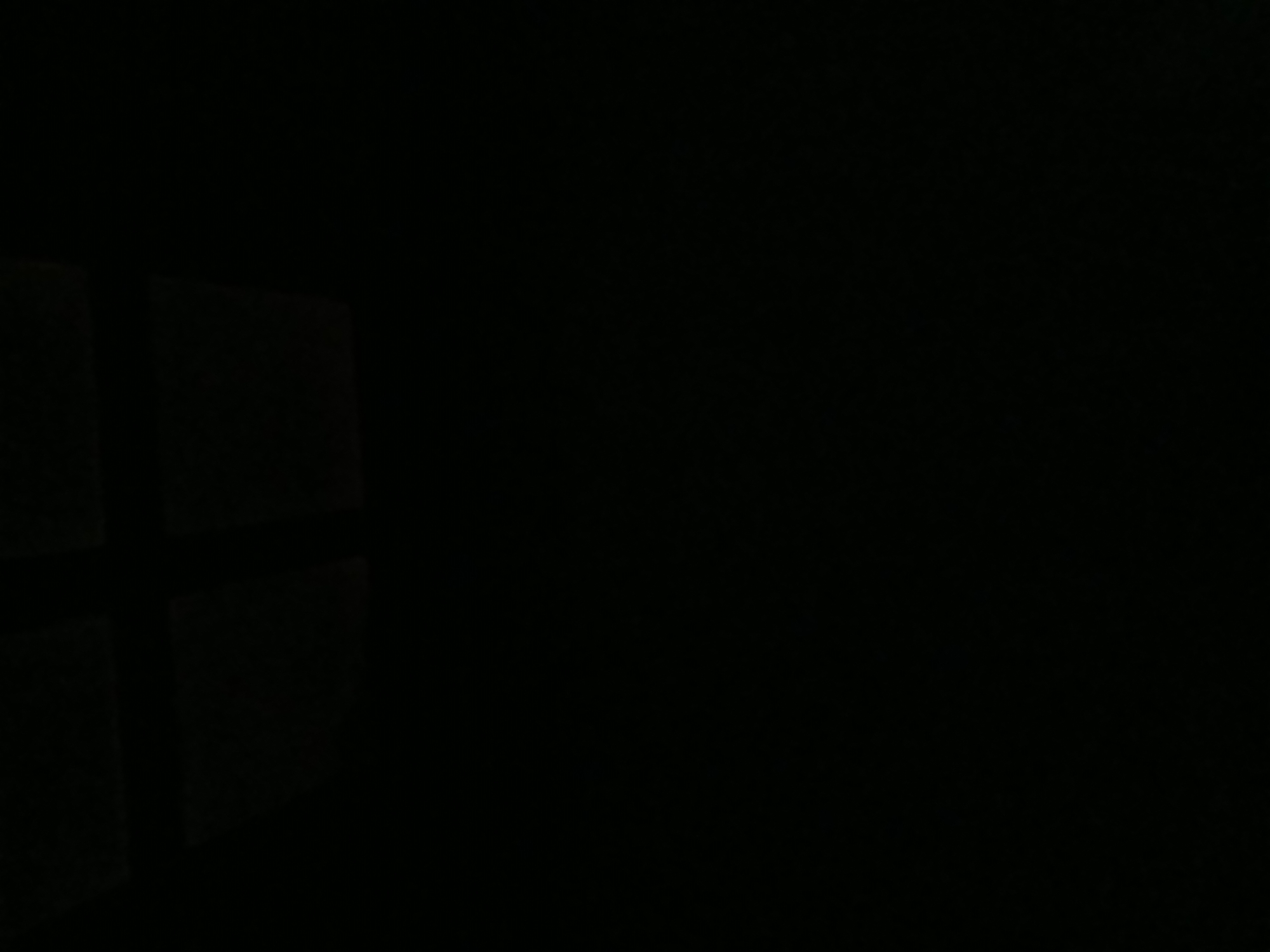 The image is extremely dark, making it impossible to discern any details about people, subjects, objects, actions, interactions, or the environment. There is no discernible information to suggest a location in Tenggarang, Indonesia, or any other identifiable setting. The image appears to be entirely black.
