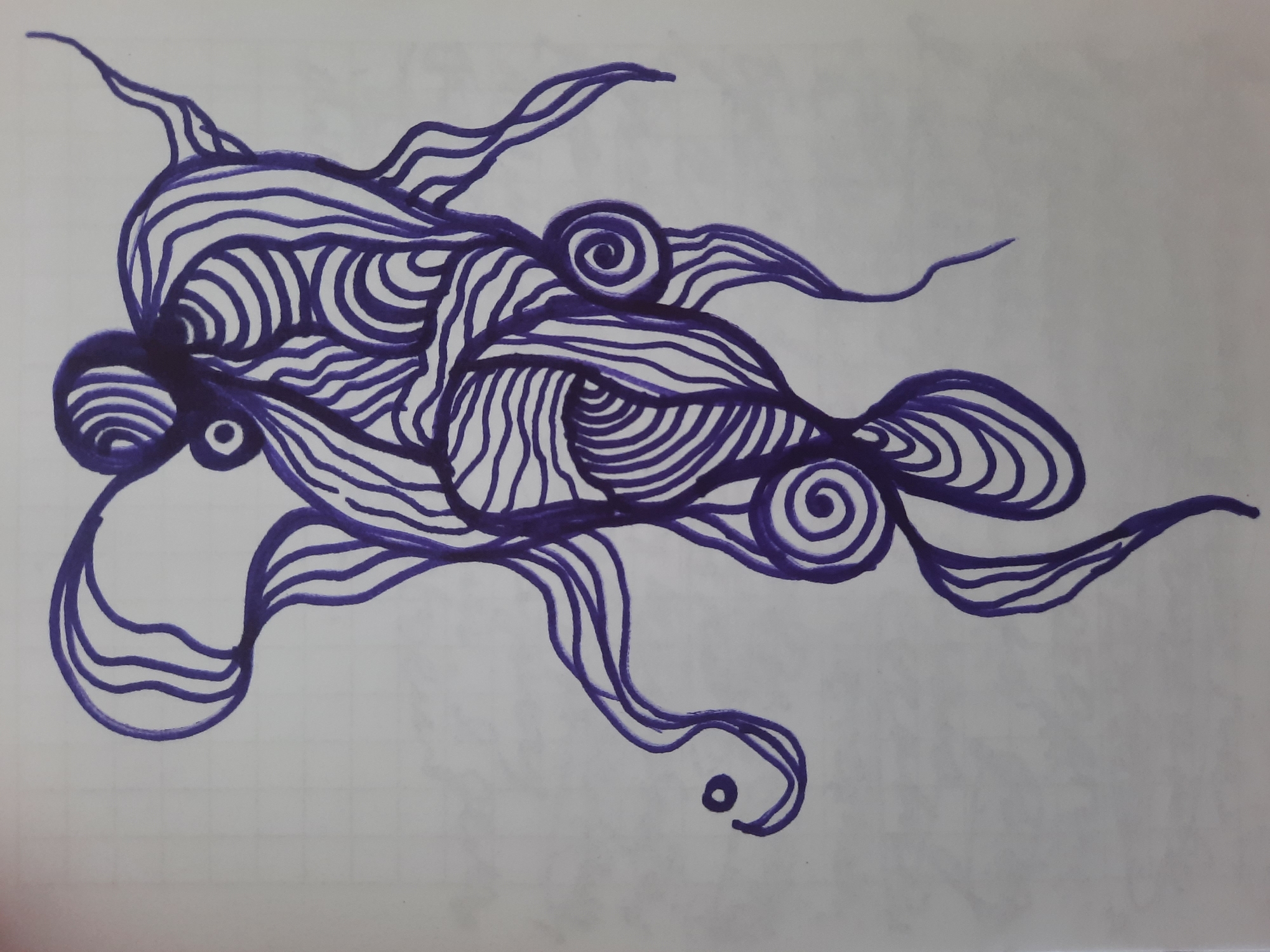This is a photograph of a drawing made with a purple marker on white paper, which appears to be a page from a notebook with faint grid lines. The drawing is an abstract, organic form that resembles an octopus or a stylized human figure with flowing appendages. The lines are fluid and dynamic, with many curved and spiral elements. The drawing is centrally placed on the page and fills most of the frame. There are no people, objects, or environmental details from the city of Simferopol, Ukraine, present in the image. The background is a plain, lightly gridded paper.