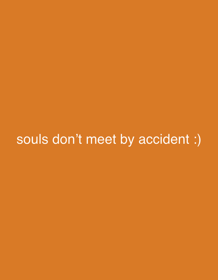 An orange background with the white text "souls don't meet by accident :)" in the center.