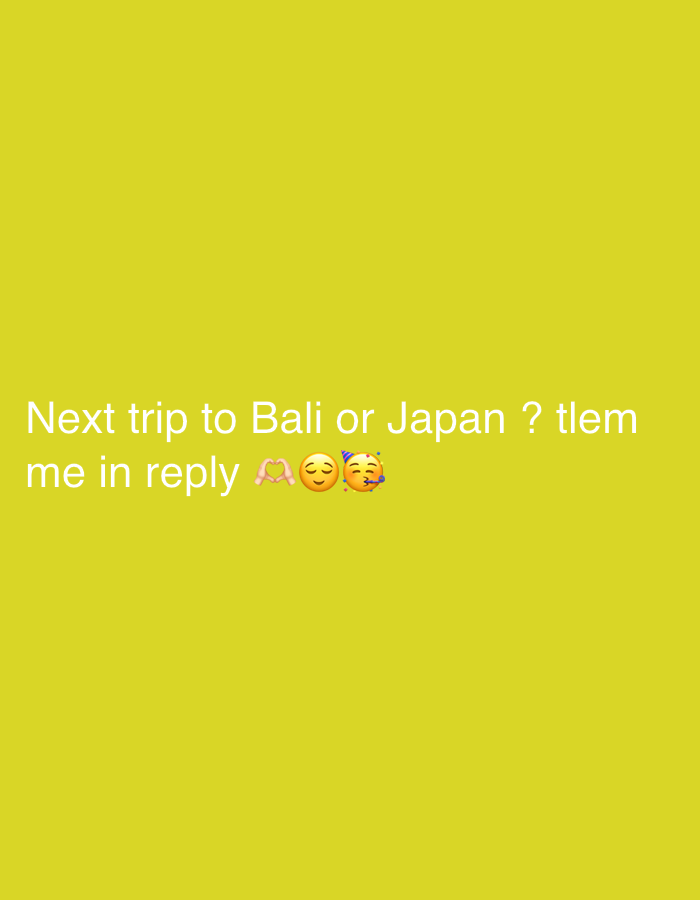 A text image against a yellow background asks, "Next trip to Bali or Japan? tlem me in reply," followed by a heart hands emoji, a smiling face emoji, and a party popper face emoji.