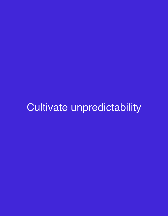 The image is a minimalist graphic with a solid, vibrant purple background. Centered on the screen, in white sans-serif font, are the words "Cultivate unpredictability". There are no people, objects, or any discernible elements that would indicate a specific location in New Stadium, Nigeria, or any other city. The image is purely typographic.