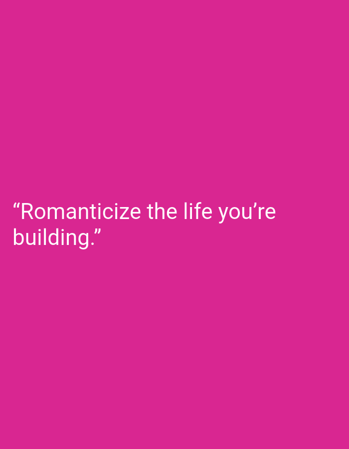 The image contains white text on a solid pink background. The text reads, "Romanticize the life you're building." There are no people, objects, or environmental elements visible in the image. The location of Muara Bulian, Indonesia is not depicted or relevant to the image content.