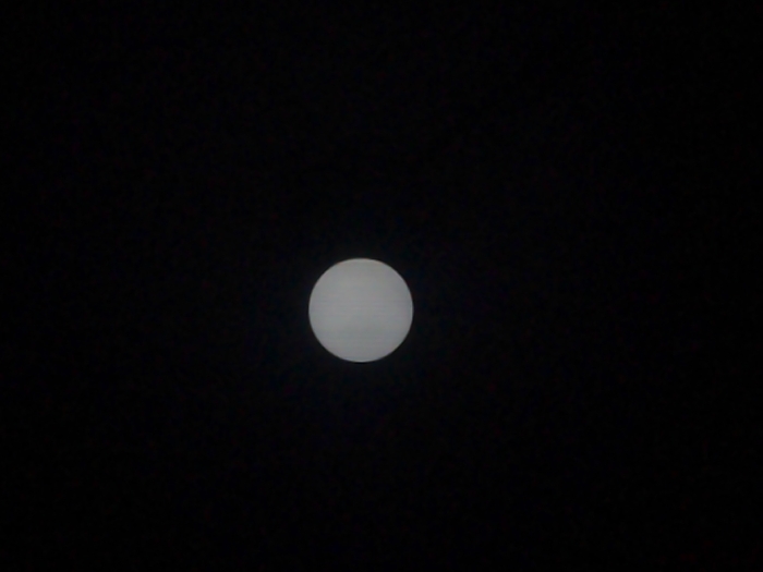 The image shows a full moon in a dark sky. The coordinates provided correspond to a location in Batam, Indonesia. The moon is white and round, and it is the only visible object in the image.