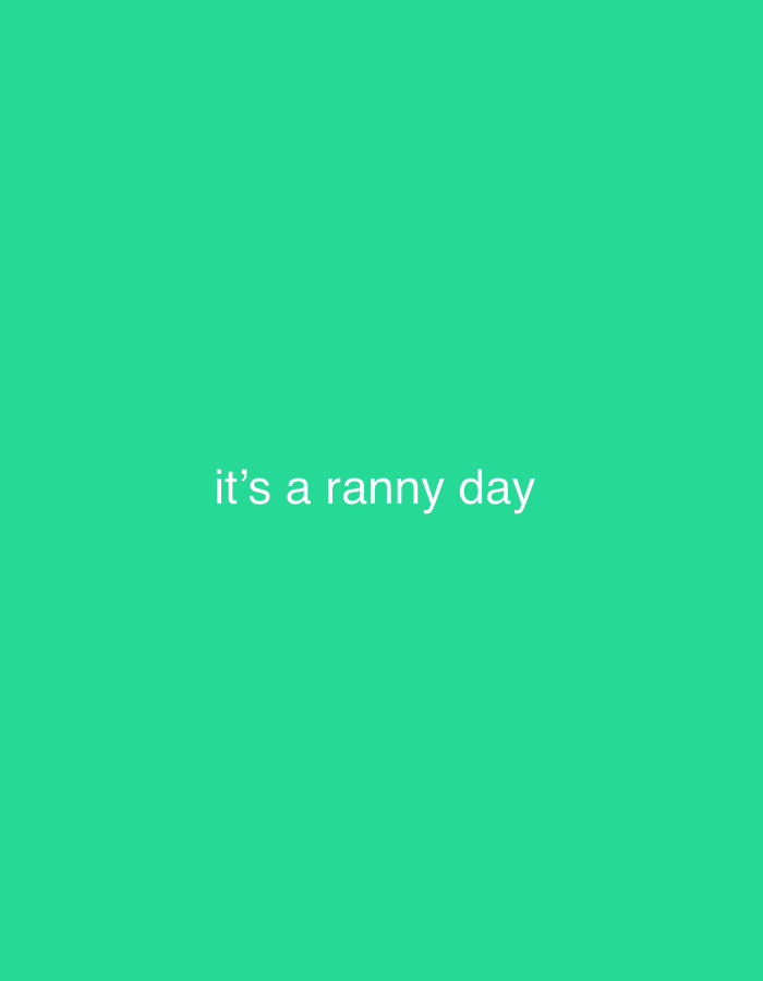 The image displays a plain, vibrant green background. Centered on this background is the white text "it's a ranny day". There are no discernible people, objects, actions, interactions, or environmental elements present in the image. The location in the city of Ihiagwa, Nigeria is not depicted.