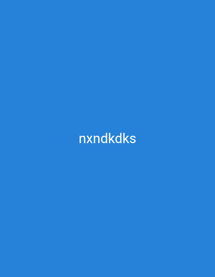 The image displays a plain, solid blue background with white text centered horizontally and positioned in the lower middle section of the frame. The text reads "nxndkdks". There are no other discernible objects, people, or environmental details present in the image. The location of Nsugpe, Nigeria is not depicted or implied in this image.