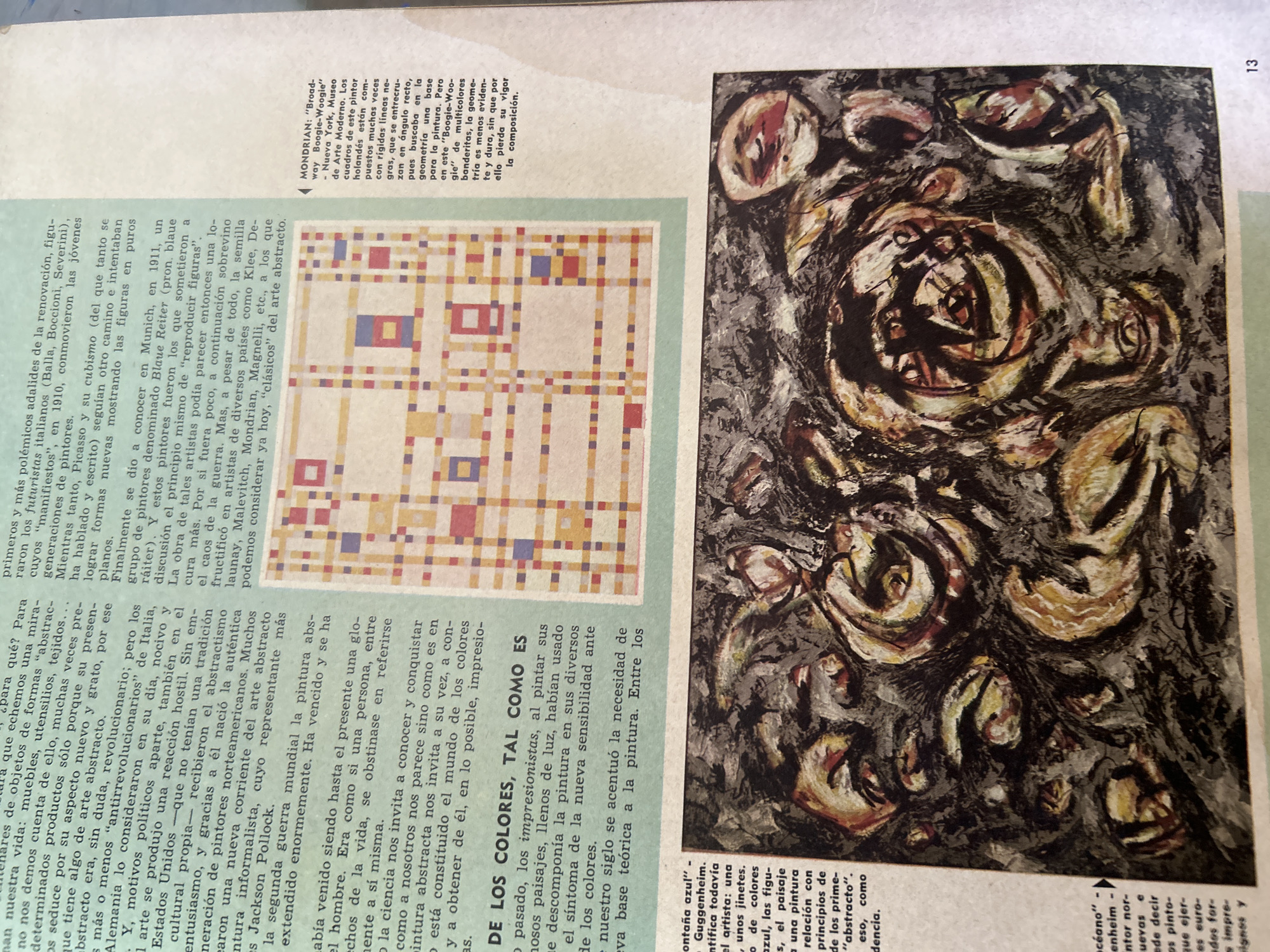 The image contains a scanned page from a publication, likely a book or magazine, featuring two pieces of art and accompanying text.
The top portion of the page displays a colorful, geometric abstract painting, possibly a work by Piet Mondrian, as indicated by a caption that mentions "Mondrian". This painting features a grid of intersecting lines in red, blue, yellow, and white, creating a series of square and rectangular blocks.
Below the abstract painting is a reproduction of a dynamic, dark-toned abstract expressionist painting. This artwork is characterized by energetic brushstrokes and swirling forms in shades of black, white, gray, yellow, and red, with hints of human-like figures or faces embedded within the chaotic composition.
To the left of these artworks, columns of text discuss the history and development of abstract art, mentioning figures like Futurist painters, Picasso, Cubism, and the Blue Rider movement. The text also references specific artworks, such as "Montaña azul" by a Guggenheim artist.
The bottom right corner of the page shows the number "13", suggesting it is page 13 of the publication.
The image is a flat-lay photograph of printed material. The lighting appears to be from above, creating some shadow and glare on the page. The page itself has a slightly yellowed hue, indicating age.
There is no information within the image or its accompanying crops that specifies a location in the city of Tacarigua, Venezuela.