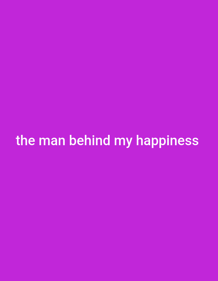 The image is a photograph of white text on a solid purple background. The text reads "the man behind my happiness". There are no people, objects, or environmental details visible in the image, and therefore it is not possible to determine its location in Gboko, Nigeria.