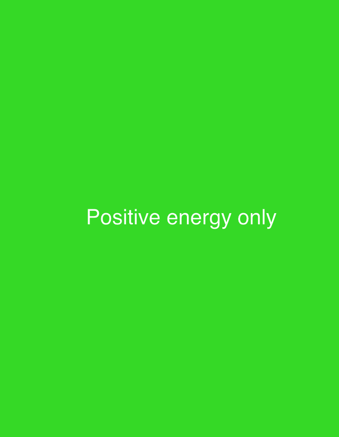 The image displays a green background with the words "Positive energy only" written in white, centered in the middle of the frame. The location in Baan Mae Nam, Thailand is not discernible from the image itself.