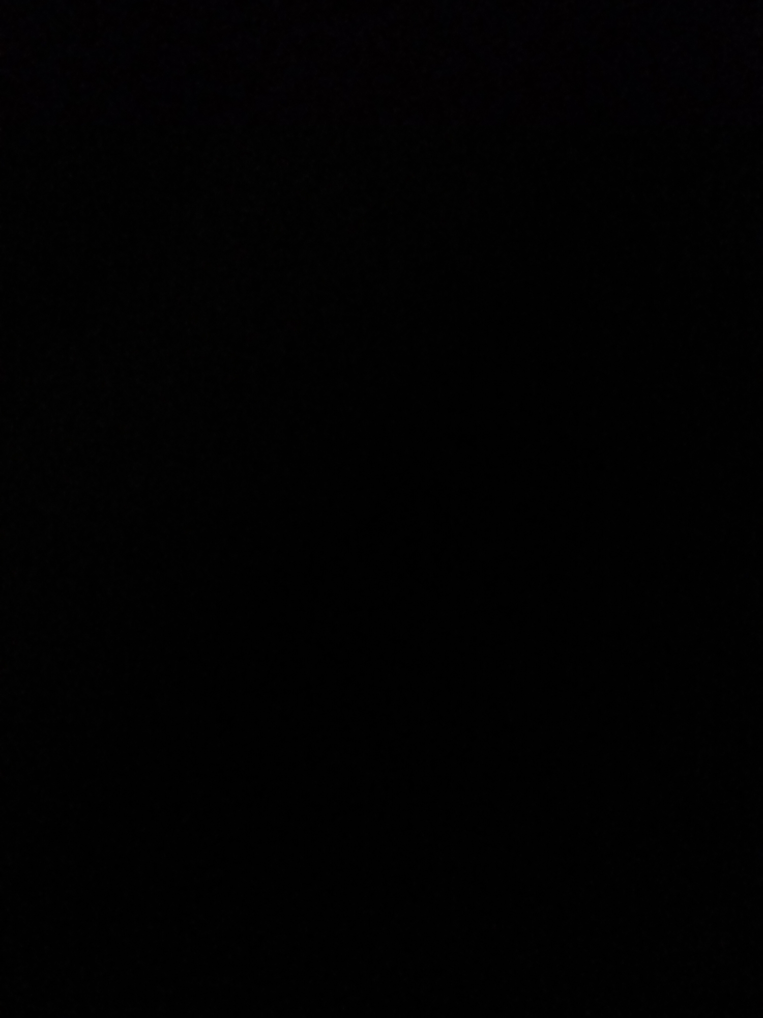 The image is a solid black frame with no discernible content.