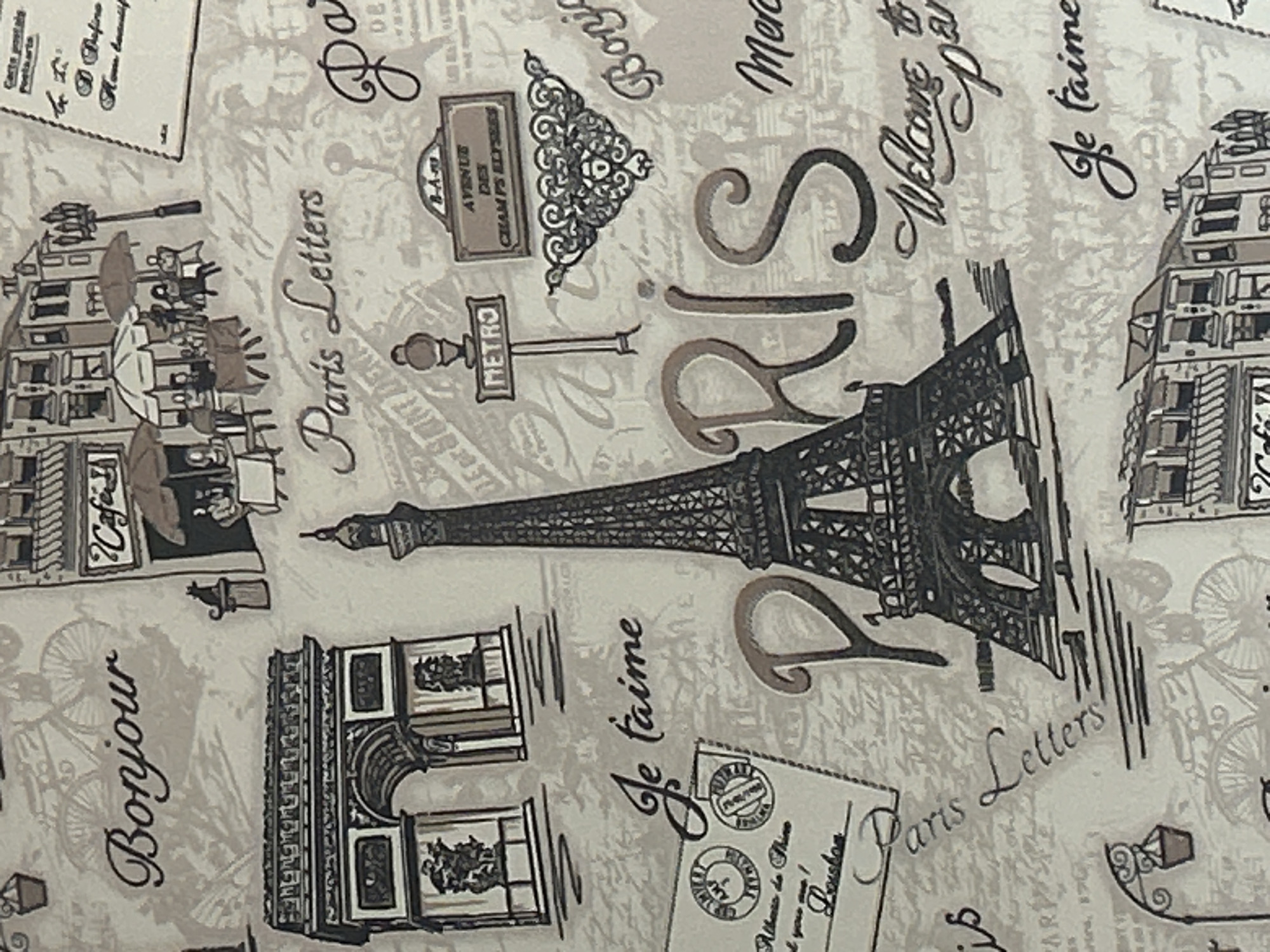 The image shows a pattern design reminiscent of Paris, France. Key elements include: the Eiffel Tower, the Arc de Triomphe, cafes, the Metro sign, an Avenue des Champs-Élysées sign, the word "Bonjour", and French phrases like "Je t'aime", and "Paris Letters".