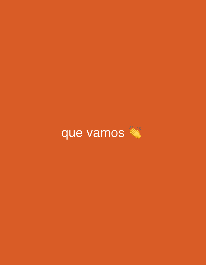 The image displays a simple digital graphic featuring a solid, vibrant orange background. Centered on this background, white text reads "que vamos". To the immediate right of the text, a clapping hands emoji is present, depicted with a light skin tone. The phrase "que vamos" translates from Spanish to "that we go" or "let's go," and combined with the clapping emoji, it conveys a sense of encouragement, agreement, or anticipation for an action or event. The overall tone suggested by the text and emoji is one of enthusiasm or readiness. There are no other discernible subjects, objects, or a specific scene, making it a clear, text-based graphic. No time of day, weather, or specific location cues are visible within the image itself, though it is associated with Santa Ana, Venezuela according to the provided context.