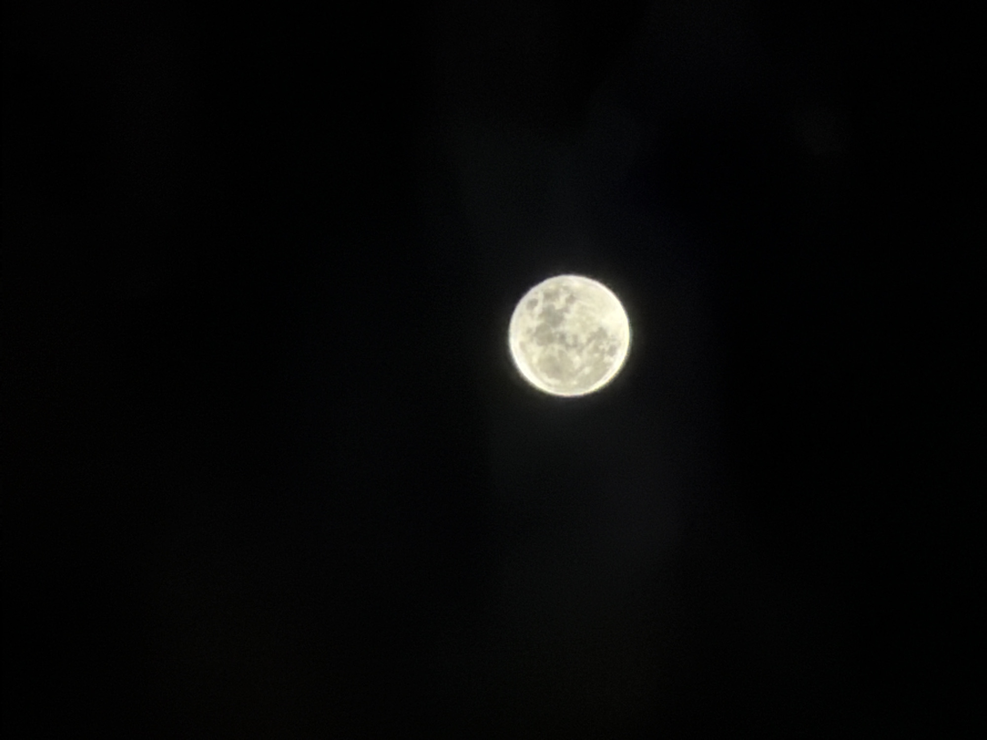 The image shows the moon in a dark sky. The moon is a full, round disc and it appears to be the only visible object. No other objects or people are visible. It is impossible to confirm the location as Batumi, Georgia.