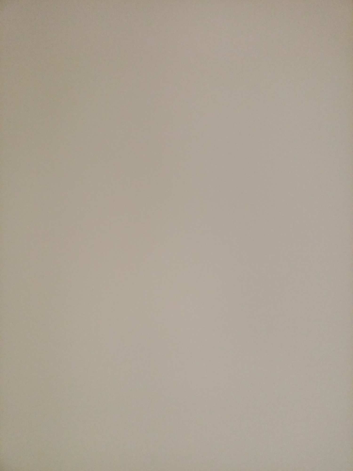 The image is a close-up, top-down view of a plain, light beige surface. There are no discernable objects, people, or actions depicted. The lighting is even, casting no shadows. The texture appears to be slightly rough, possibly of fabric or paper. There is no context that would place this image in Rostov-on-Don or any other specific location.