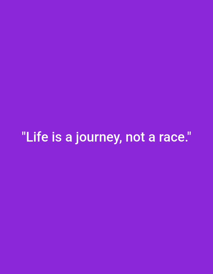 The image displays a plain purple background with white text centered horizontally. The text reads: "Life is a journey, not a race." There is no discernible location in Ploso, Indonesia, or any people, subjects, objects, or actions depicted in this image.