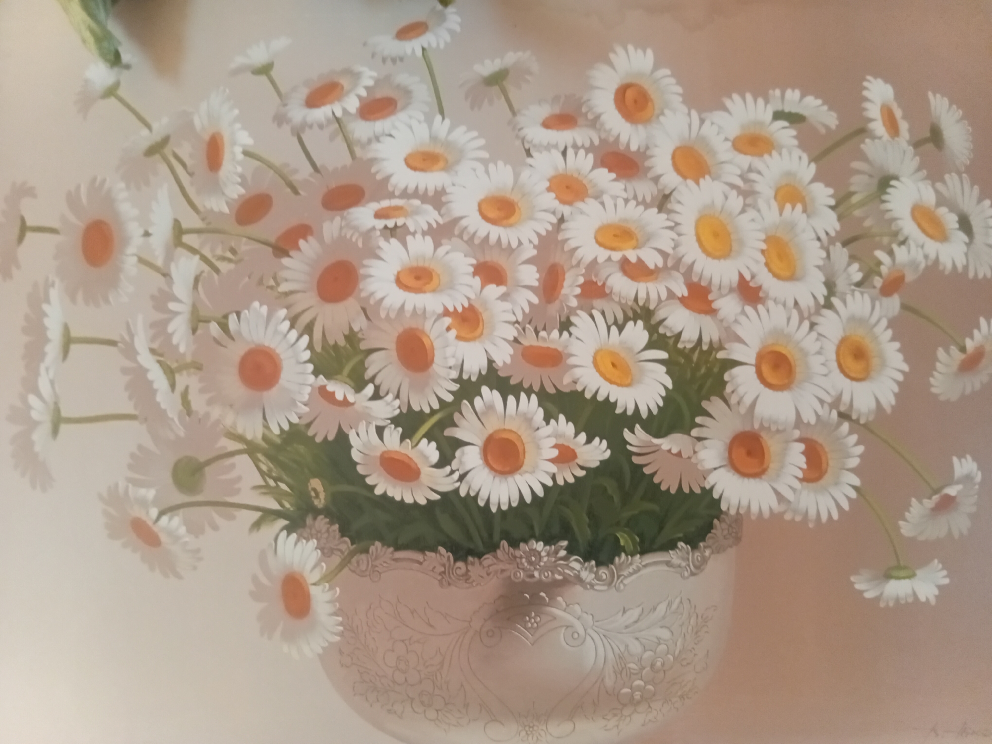 This is a painting of a bouquet of daisies in a decorative silver vase. The daisies are white with yellow centers and are arranged in a lush bunch, with some stems and leaves visible. The vase has an ornate, embossed design featuring floral motifs and a heart shape in the center. The background is a soft, gradient of pale peachy-pink, creating a gentle and serene atmosphere. The lighting appears soft and diffused, suggesting it might be indoors or during a quiet time of day. There is no apparent activity or event taking place, as the focus is solely on the still life arrangement. No text is visible in the painting. The overall emotion conveyed is one of natural beauty, simplicity, and gentle elegance.
