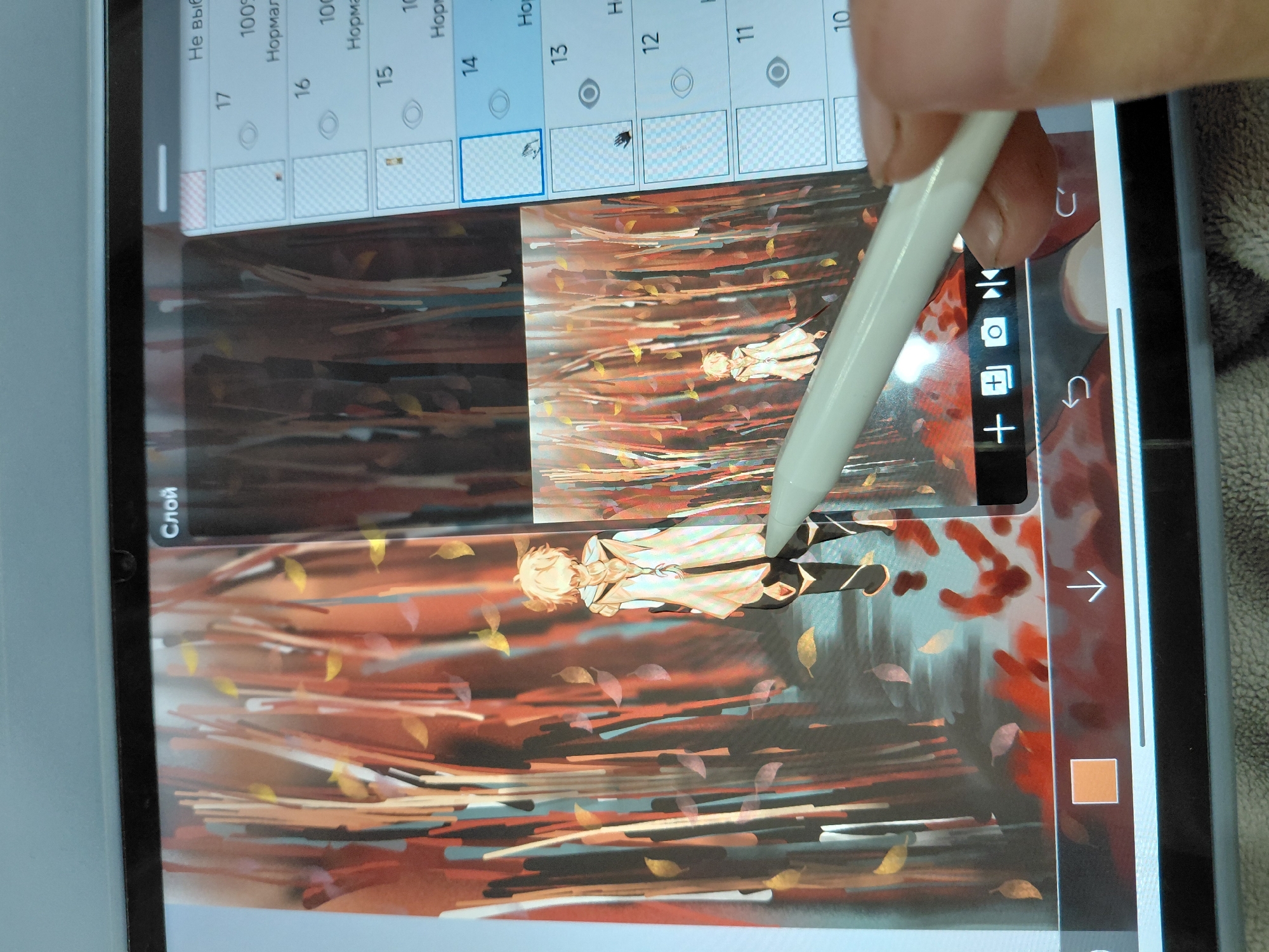 The image shows a tablet screen displaying digital artwork in progress. The artwork depicts a stylized figure, possibly a person, standing in a forest-like setting with trees and falling leaves rendered in warm, autumnal colors. The user is holding a stylus, likely an Apple Pencil, and appears to be working on the artwork in a digital painting application. The application's interface is visible at the top, showing various layers and tools typical of such software. It's impossible to determine the exact location of Nadym, Russia without other information.