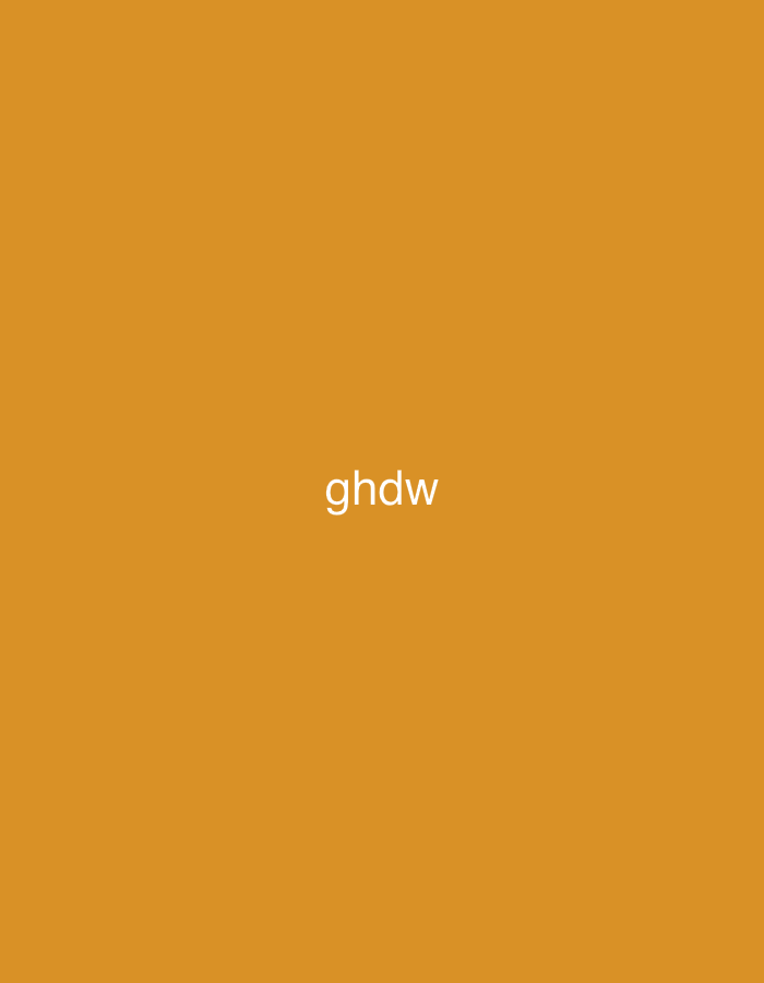 The image presents a minimalist, two-dimensional graphic featuring a solid, uniform background in an ochre or burnt orange color. Centered horizontally and slightly below the vertical mid-point, the white, sans-serif, lowercase text "ghdw" is displayed. There are no discernible people, additional subjects, objects, or actions depicted within the frame. The environment is entirely abstract, consisting solely of the colored background and text. The image does not contain any visual elements or contextual information that would indicate a physical location in Casablanca, Morocco, or any other specific geographical area.