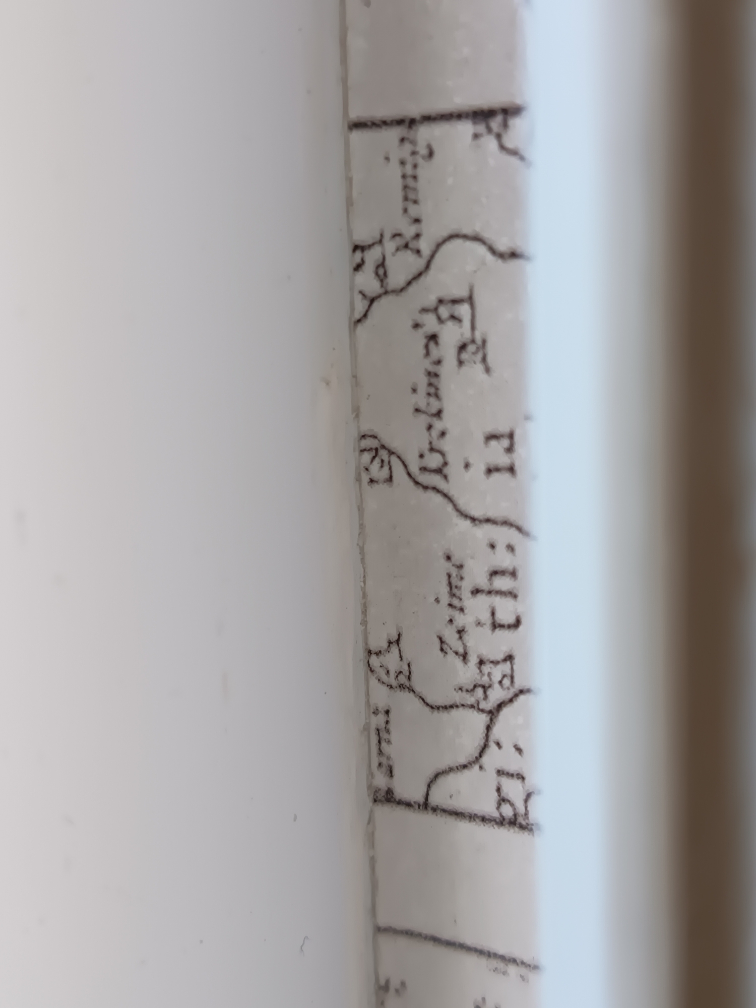 The image shows a portion of an old map with handwritten text and topographical features. The visible text appears to be in Cyrillic script. One prominent word is "Ізмаїл" (Izmail), indicating the city of Izmail, Ukraine. Other visible text includes what appears to be "Одесская" (Odesskaya) and possibly "губернія" (guberniya), suggesting the administrative region of Odessa Oblast. The map depicts a body of water, possibly the Danube River or a tributary, with landmasses and settlements indicated by lines and small drawings. The style of the map suggests it is from the 19th or early 20th century. The image is cropped and partially out of focus, making it difficult to discern finer details.