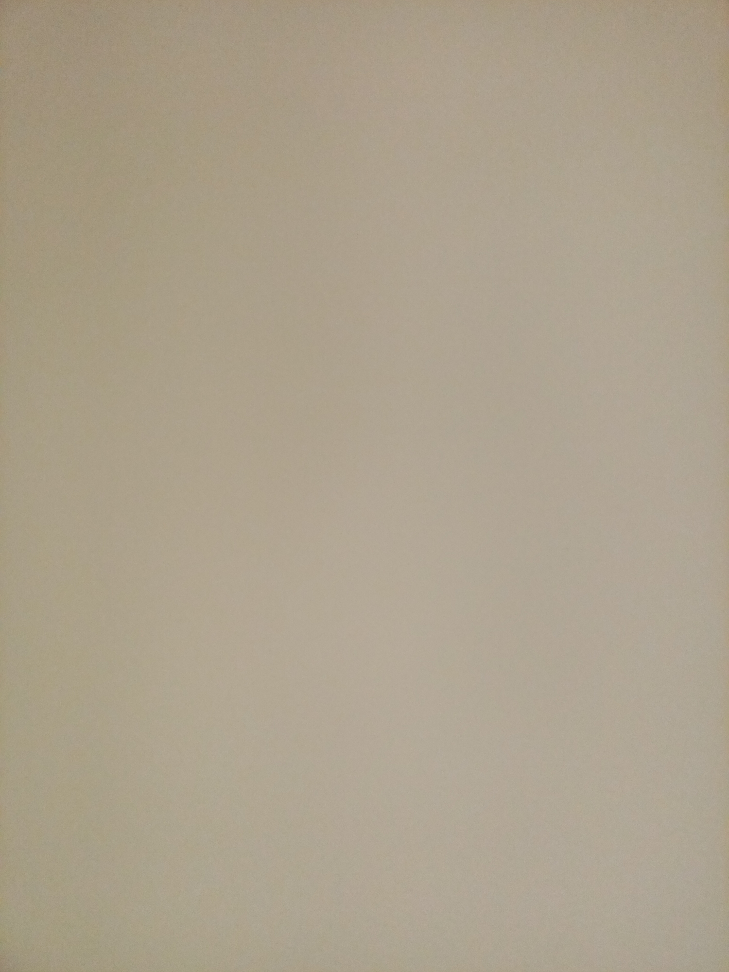 The image is a blank, textured surface with a light brown or beige hue. It appears to be a photograph of a wall or a similar flat, unadorned surface. There are no discernible objects, people, or actions present in the image. The lighting is even and diffused, with no strong shadows or highlights. The texture appears to be slightly grainy, suggesting it might be a painted surface or wallpaper. There is no information in the image that would allow for identification of its location in Rostov-on-Don, Russia.