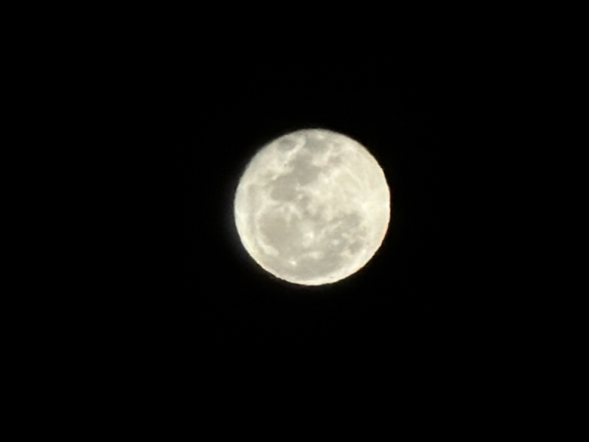 A full moon dominates the image, set against a completely black sky. No other objects or people are visible in the frame. There is no information provided to suggest this image was taken in Izhevsk, Russia, or any other specific location.