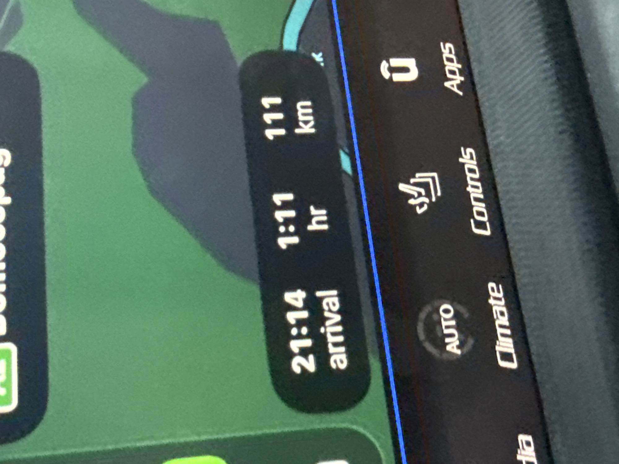 The image shows a car's infotainment screen displaying navigation information. The estimated arrival time is 21:14, with a remaining travel time of 1 hour and 11 minutes, covering a distance of 111 kilometers. The screen also has icons for "Controls" and "Apps," as well as text for "Climate."
The location Peshterna, Bulgaria is not visible.