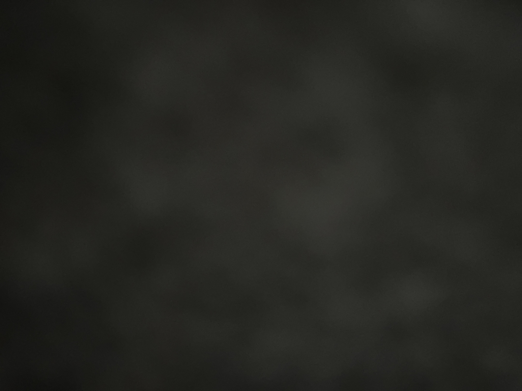 The image is a dark, monochromatic, out-of-focus abstract background. There are no discernible objects, people, or environmental details, making it impossible to identify a specific location, such as Casablanca, Morocco. The image appears to be a blurred texture or a digitally generated background with no clear subject matter.
