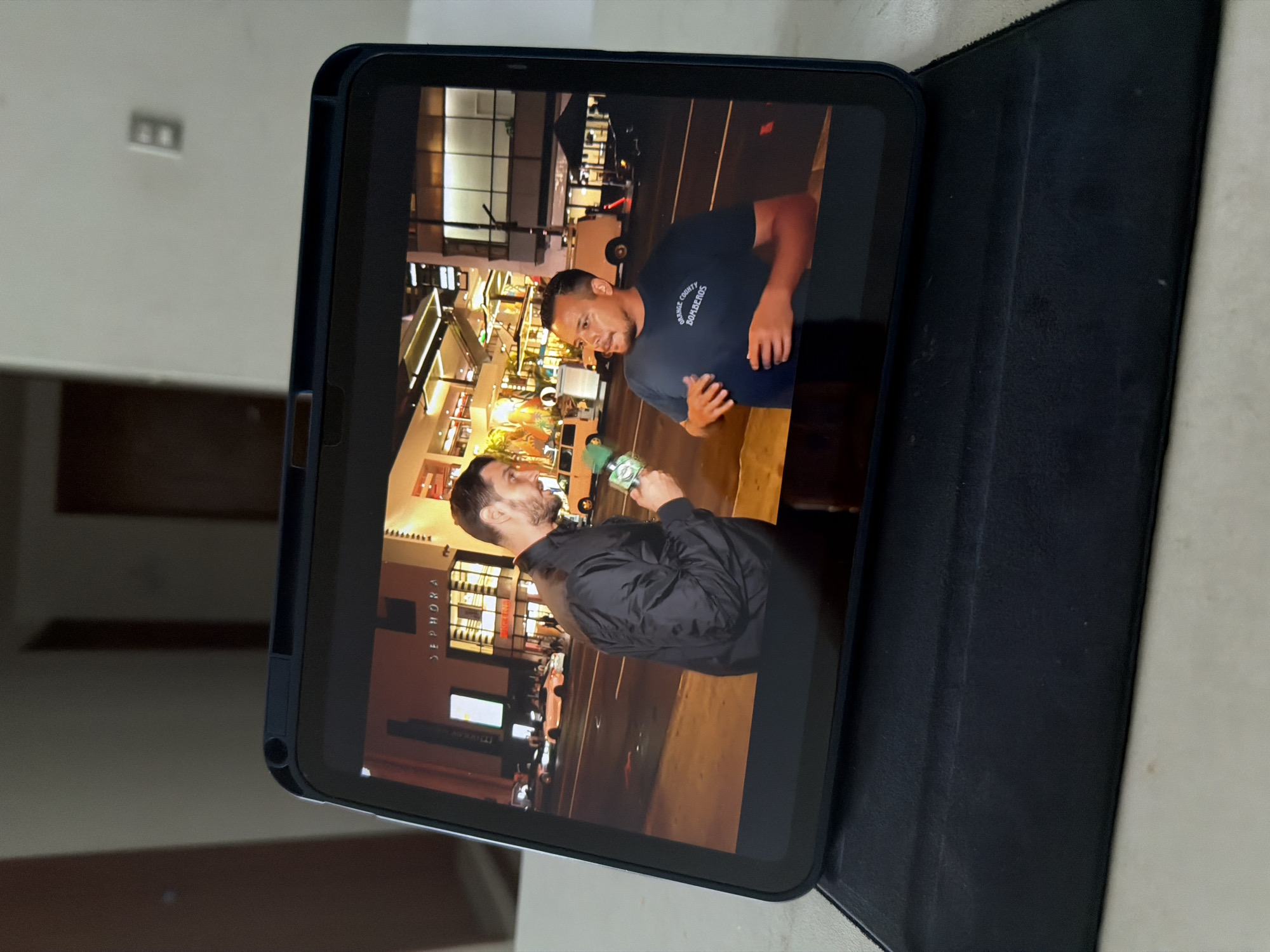 A person is being interviewed outside of a Sephora store on a street in San Andrés Cholula, Mexico.