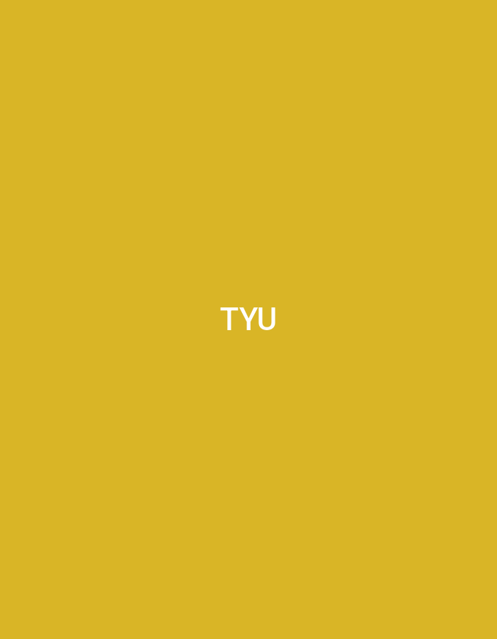 The image displays a uniform, solid mustard yellow background. Centered within this field is the white, sans-serif text "TYU." No other discernible objects, individuals, actions, or environmental details are present within the frame. The scene is situated in the city of Casablanca, Morocco.
