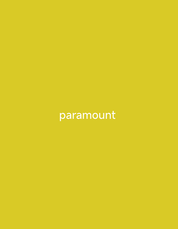 The image displays the word "paramount" in white, sans-serif font centered horizontally and located towards the bottom half of the frame. The background is a solid, vibrant yellow. There are no people, objects, or discernible scene or setting elements other than the text and its background. No activity or event is depicted. There are no specific time of day, weather, or location cues. The word "paramount" is the only visible text.