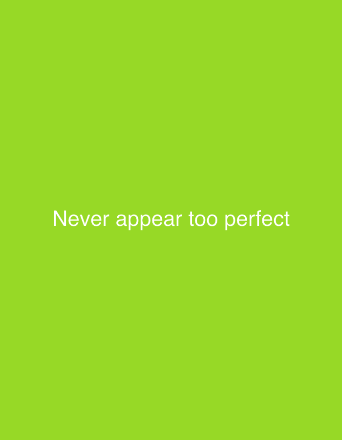 The image shows a bright green background with white text that reads "Never appear too perfect". There are no people, subjects, objects, actions, or interactions visible. The environment is a plain, unadorned green surface. The location of New Stadium, Nigeria is not depicted or implied by the image.