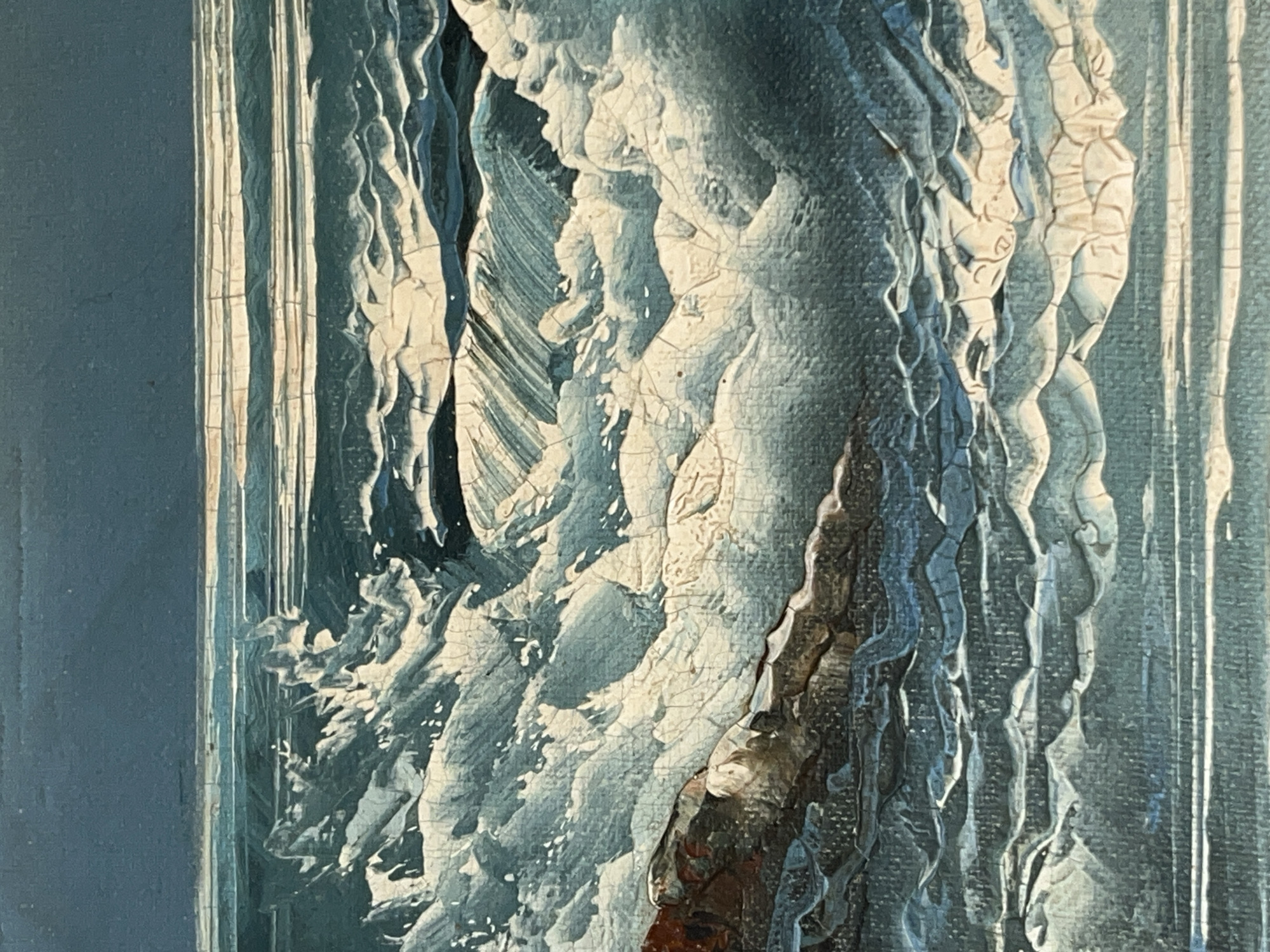 This is a close-up of a textured painting, primarily in shades of blue, white, and gray, with some brown accents. The paint is thick and cracked, giving the impression of age or deliberate artistic technique. The subject matter appears to be an abstract representation of water or a flowing liquid, with vertical lines and swirling shapes suggesting movement. The scene's location is not visually discernible from the image. No people, specific objects beyond the paint itself, actions, or interactions are directly depicted. The environment is implied by the abstract representation, suggesting water or a similar element. The information regarding the location in the city of Tinaquillo, Venezuela is not contained in the image and would require outside data.