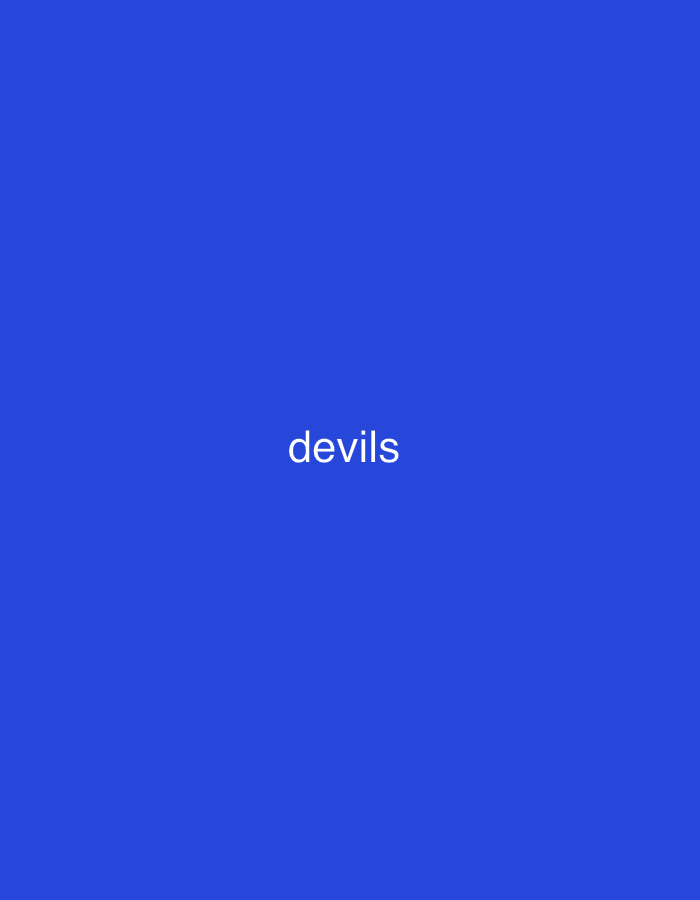 The image is a close-up of a blue background with the word "devils" written in white text. The text is centered horizontally and positioned in the lower half of the image. There is no discernible location in the city of Mayo Dasa, Nigeria.