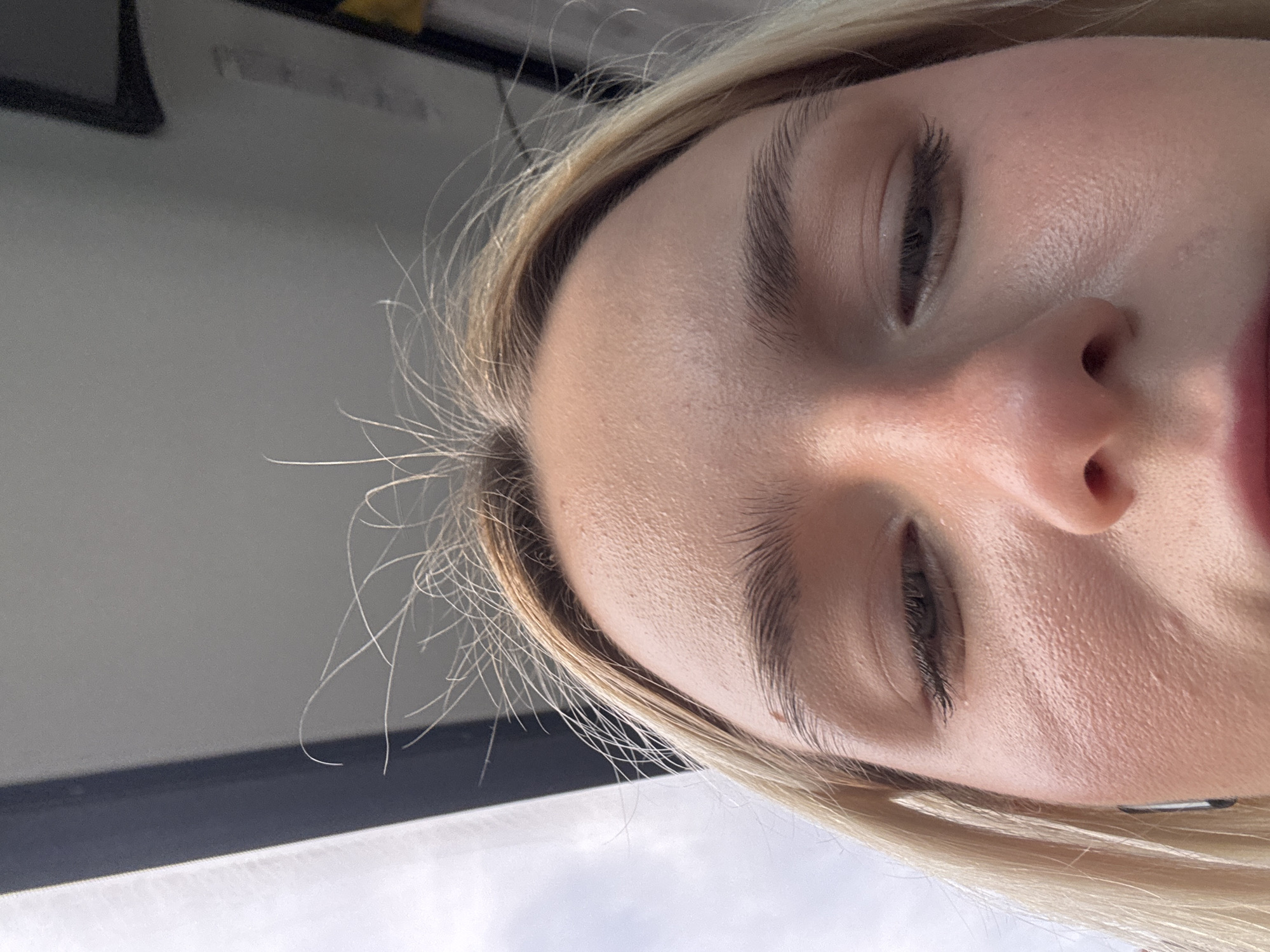 A close-up shot of a person's face, specifically the eyes, nose, and mouth. The person has light-colored hair and appears to be indoors near a window. There is no indication of Vsevolozhsk, Russia in the image.